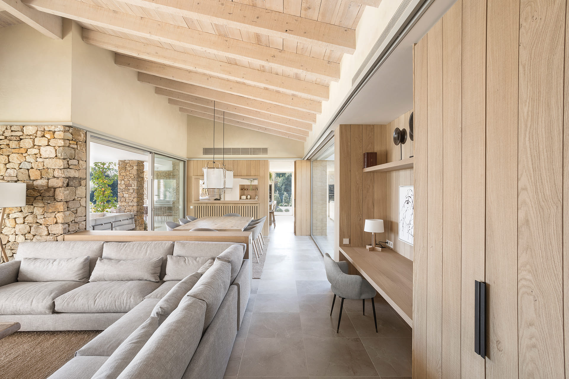 Kitchen, living area and dining area with wooden finishes