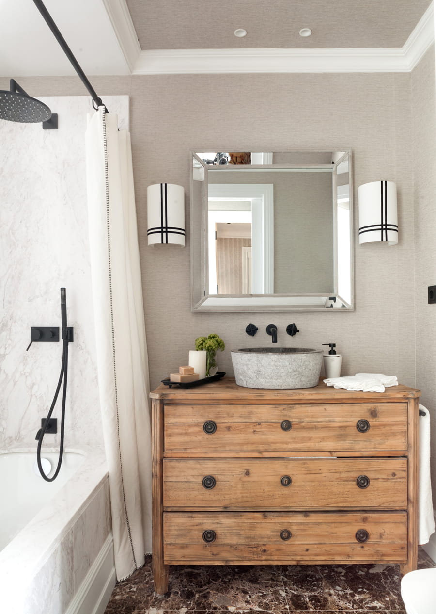 Bathroom with chest of drawers and natural stone washbasin