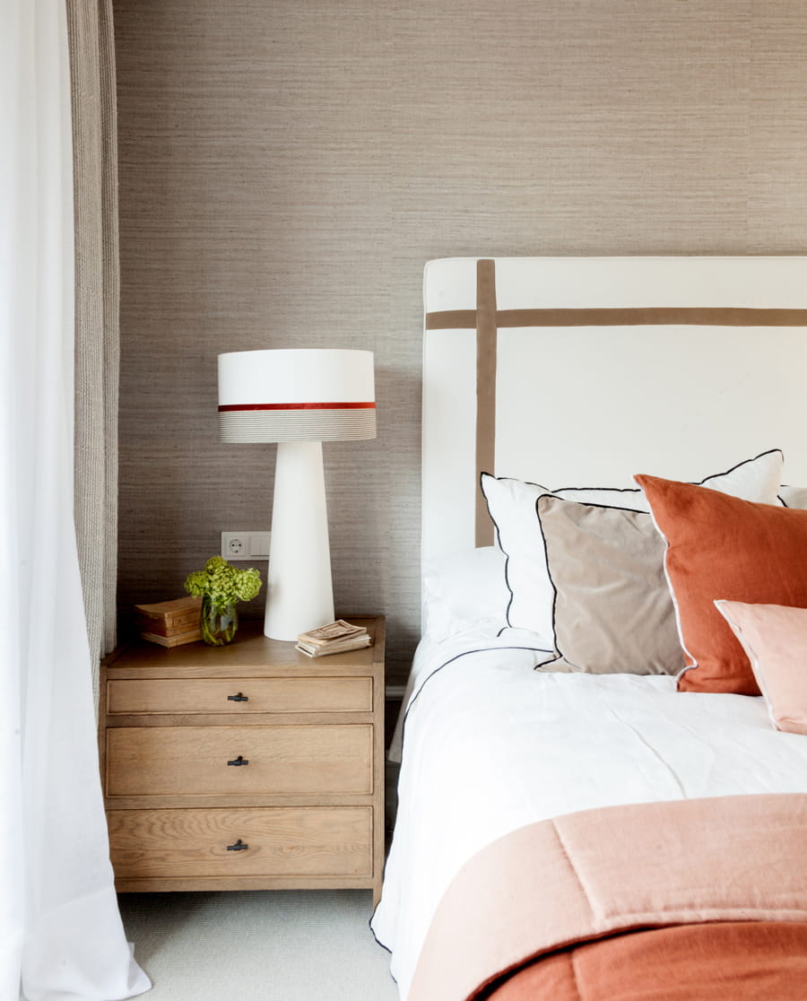 Bedside table with lamp in master bedroom