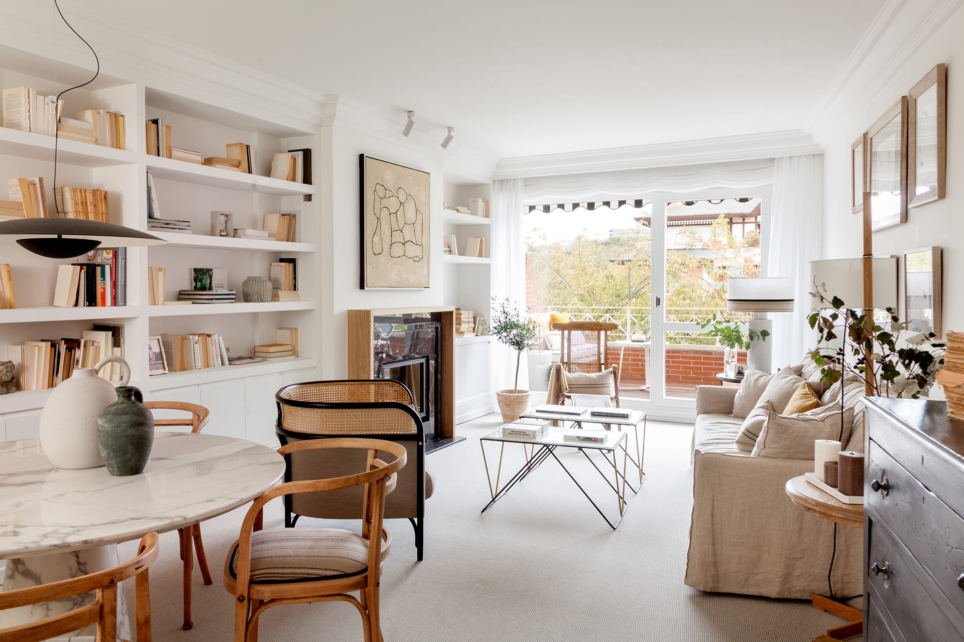 Living and dining room open to outdoor terrace