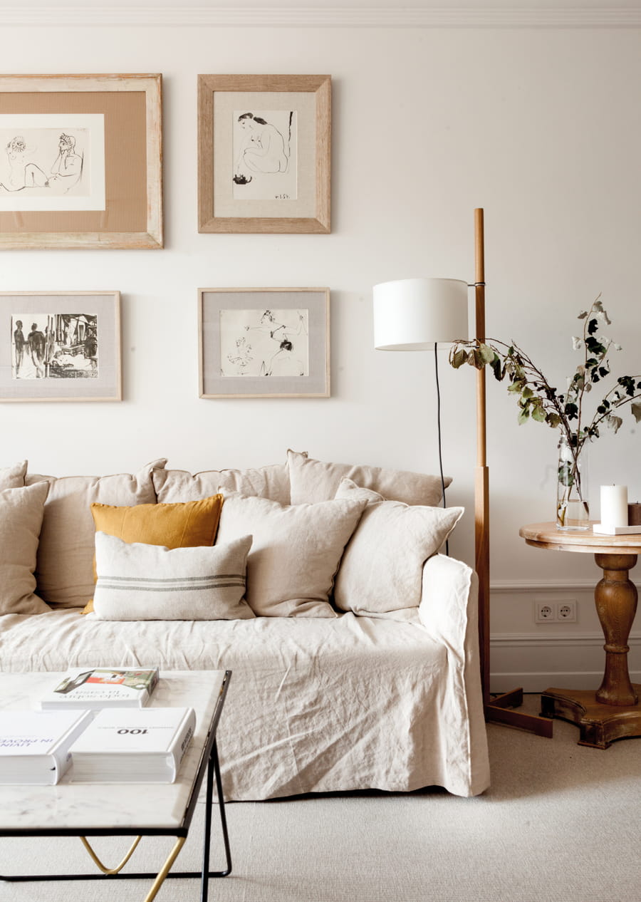 Living room with sofa, table and pictures