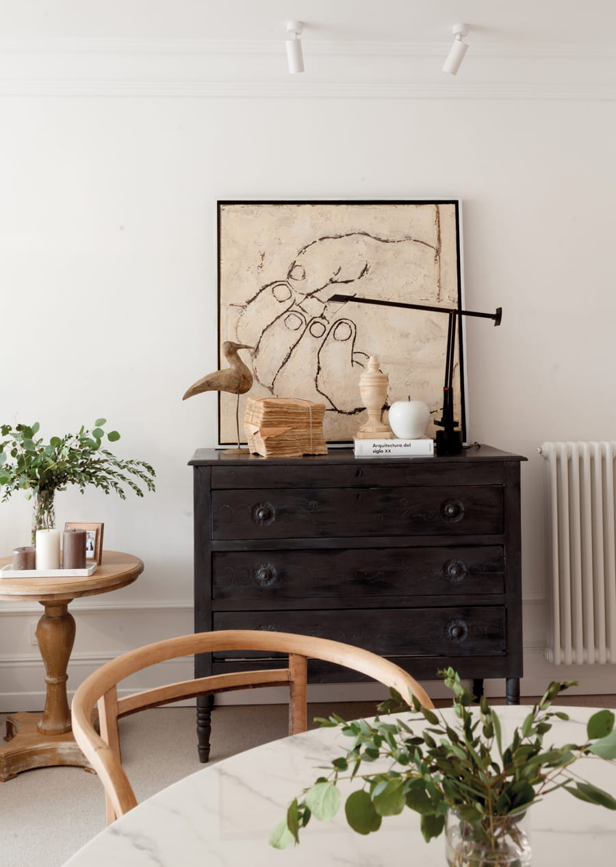 Home with lounge with chest of drawers and picture