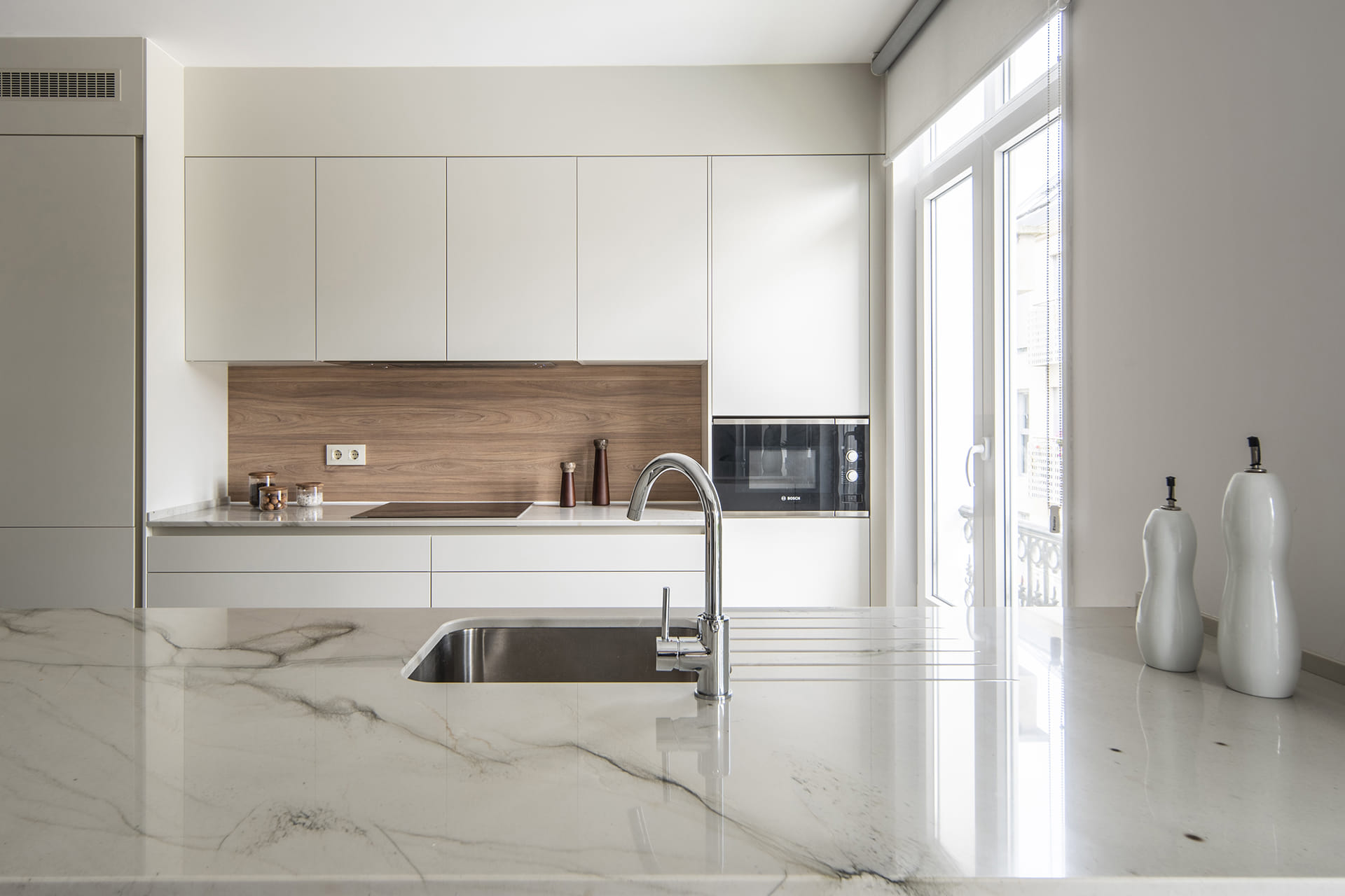 White kitchen with tall, wall and base units