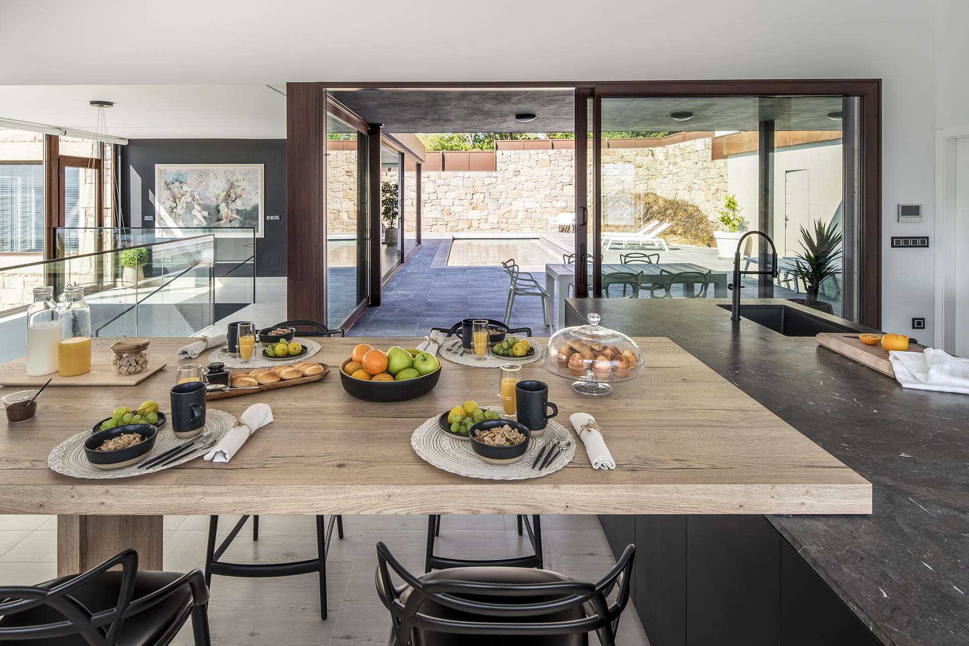 Kitchen with island open to the inside and outside of the home