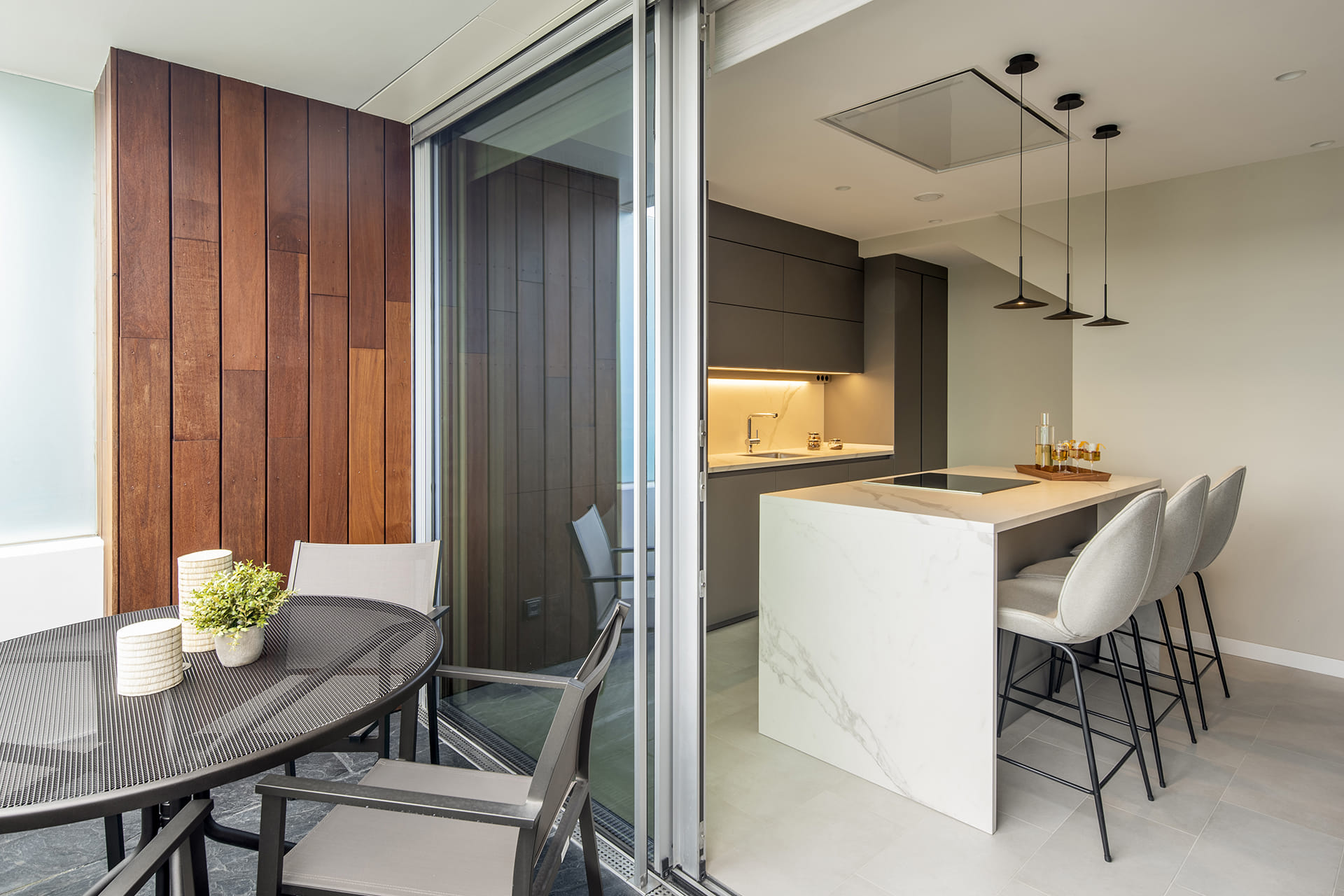 Grey Santos kitchen with island and ceiling hood