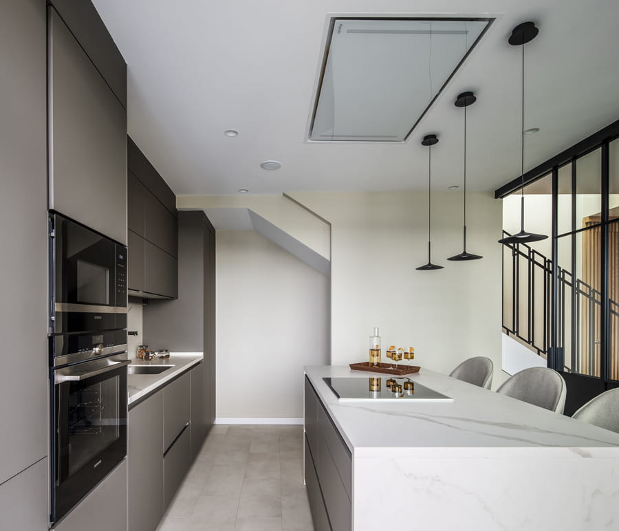 Grey kitchen with island and storage units