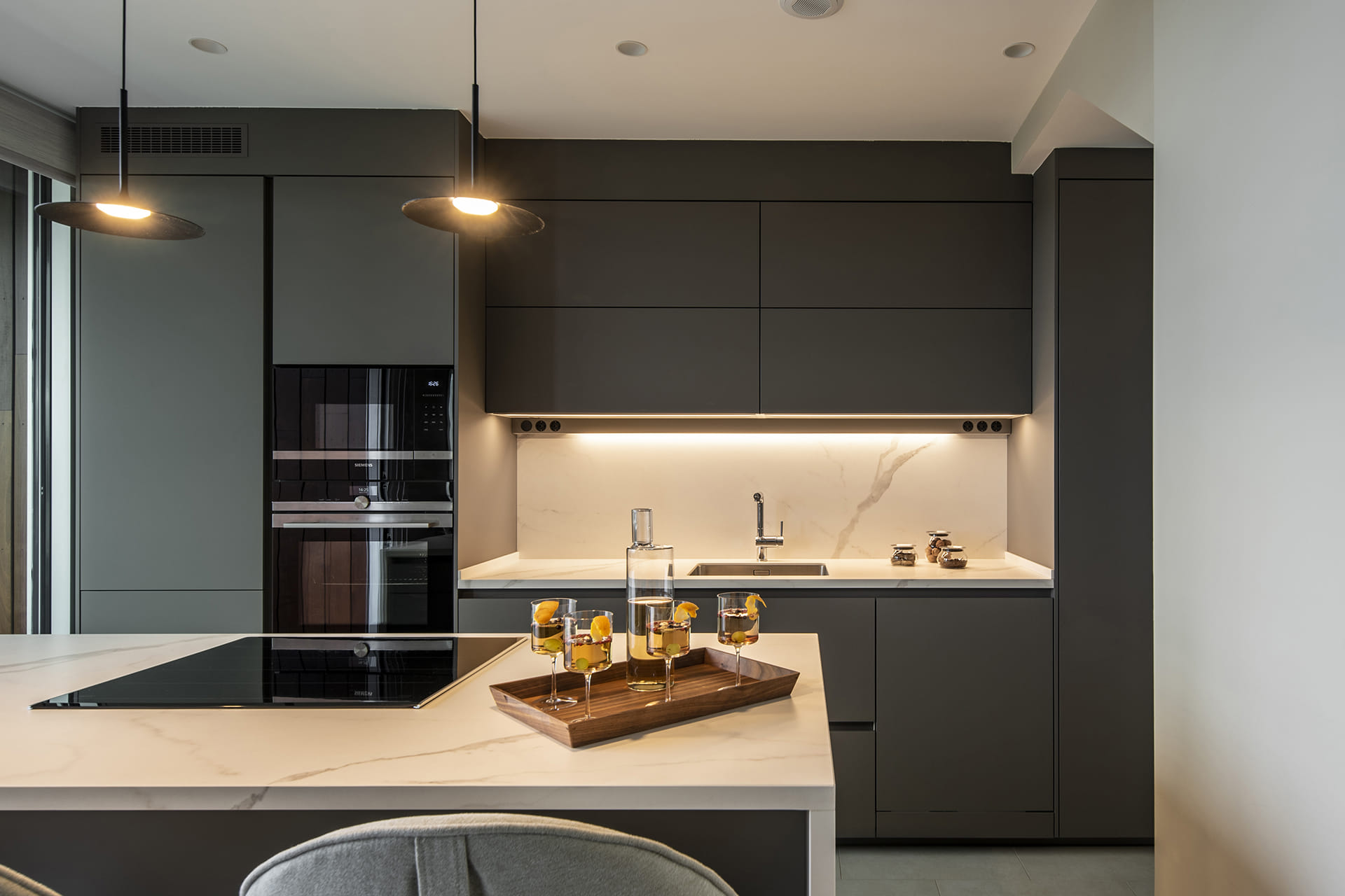 Grey Santos kitchen with island and tall units