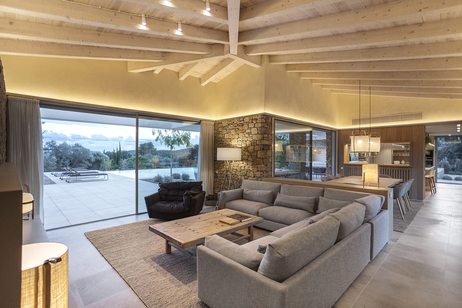 Open-plan living room and dining room in rustic home