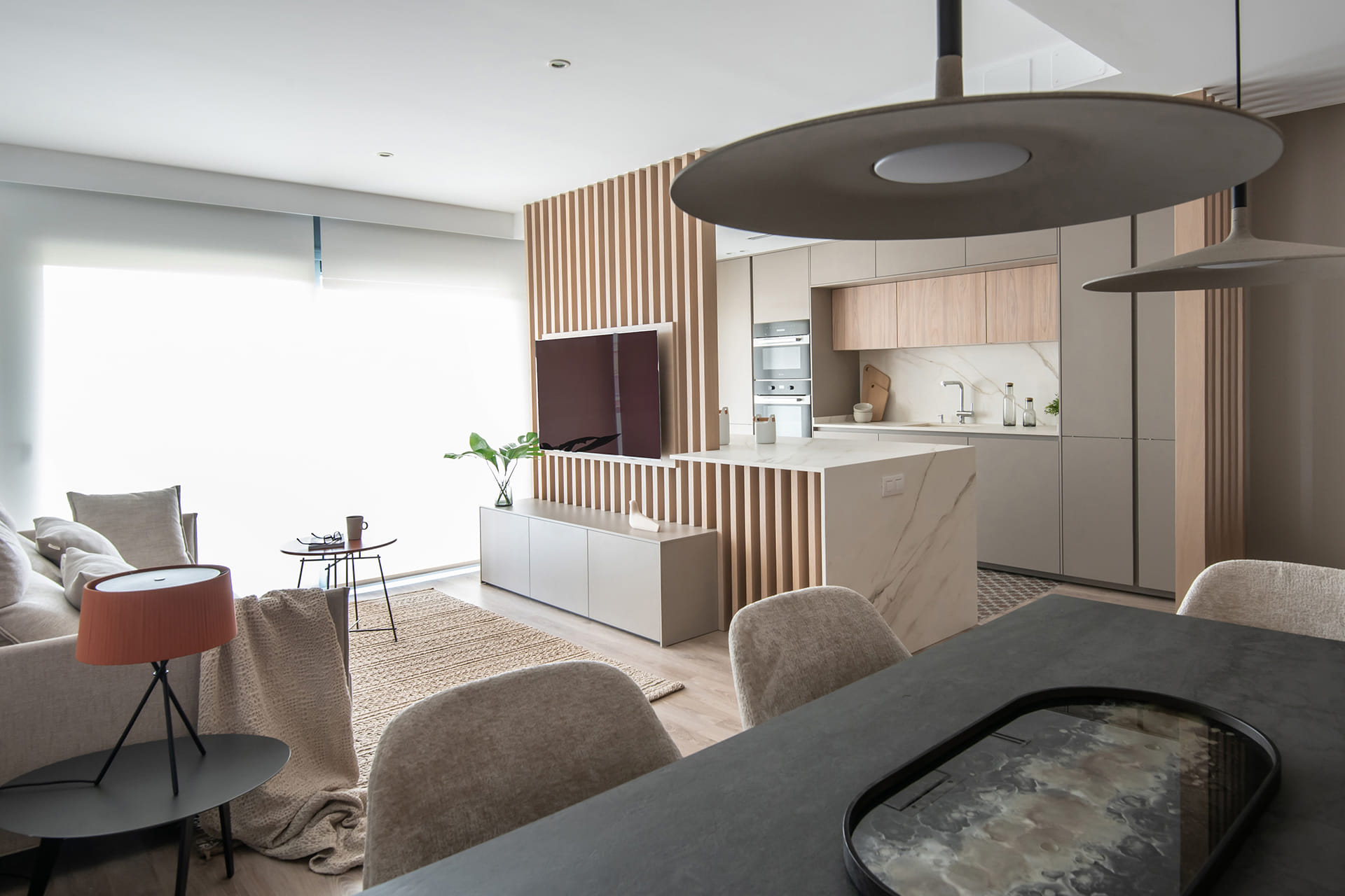 Parallel sand grey kitchen open to the lounge/diner.
