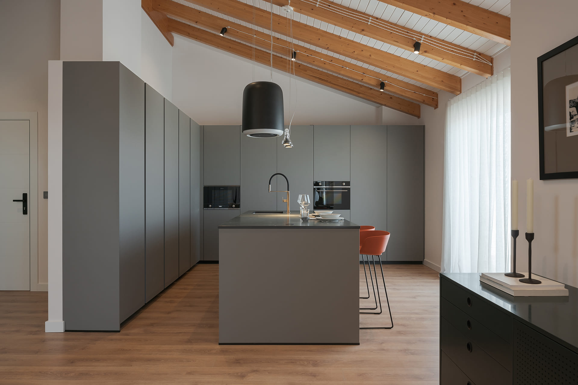 Silk mink grey kitchen with centre island, L-shaped layout.
