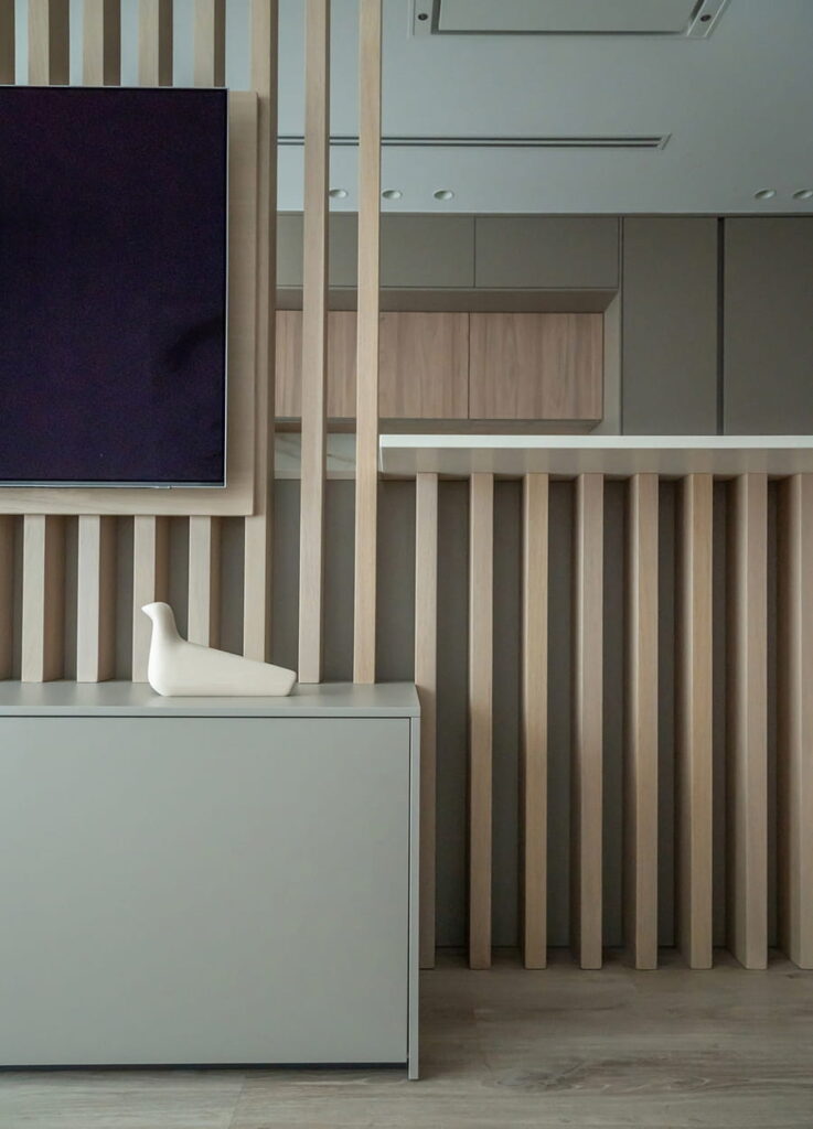 Close-up of light elm slats integrated into kitchen island.
