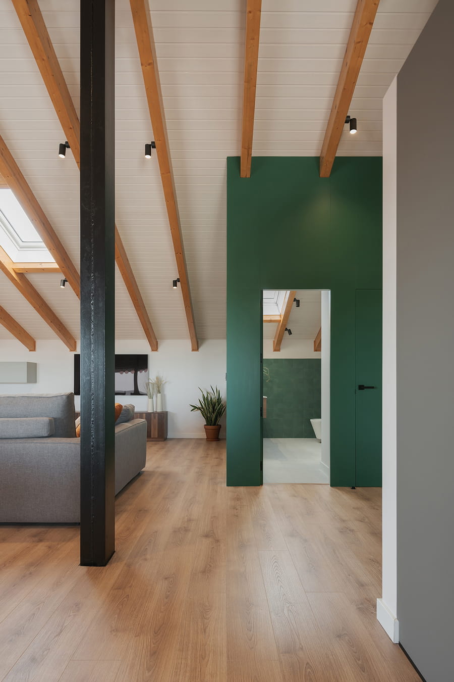 Close-up of the lounge and entrance to the bathroom.