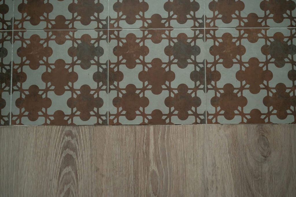 Integration of hydraulic flooring with wood flooring.