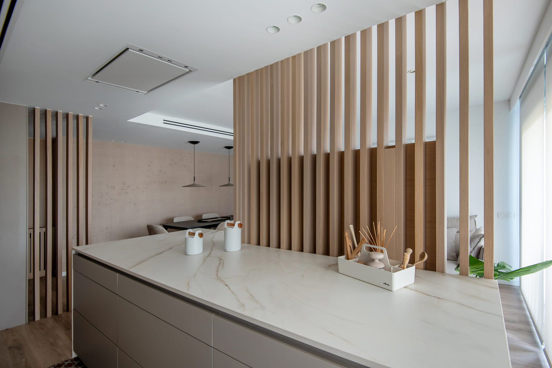 Light elm slats integrated into Santos kitchen island.