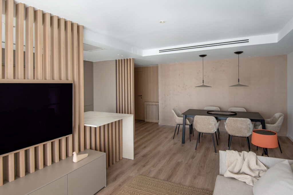 Image of the living room with light elm slatted wood dividers.