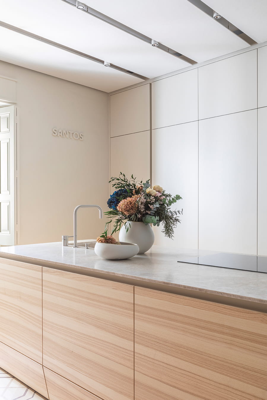 Island in Olive Ash wood and Sensa Taj Mahal worktop in Santos kitchen at Casa Decor.