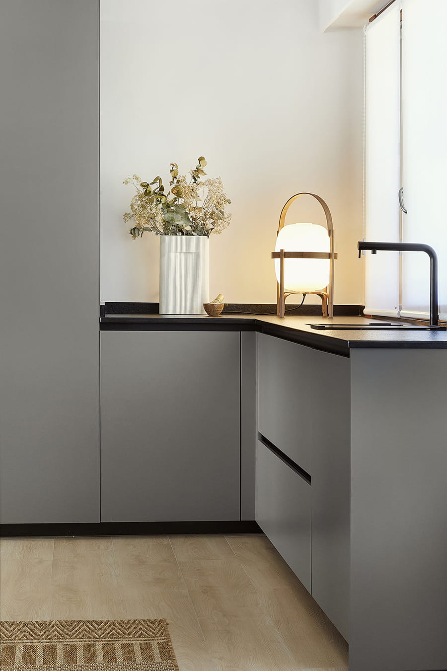 Sink area in grey Santos kitchen, bright and open-plan design.
