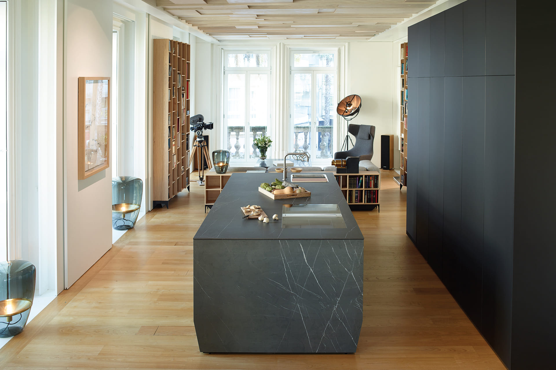 Open-plan black Santos kitchen with island.