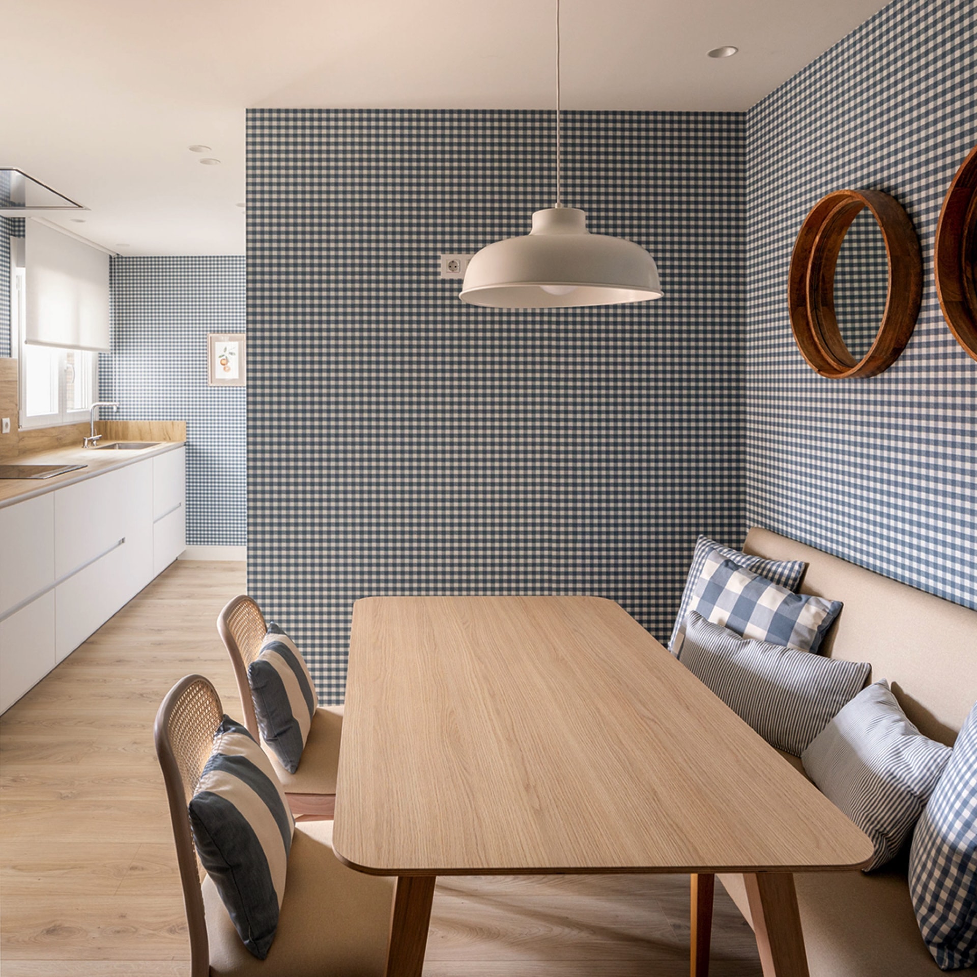 White kitchen with eat-in area.