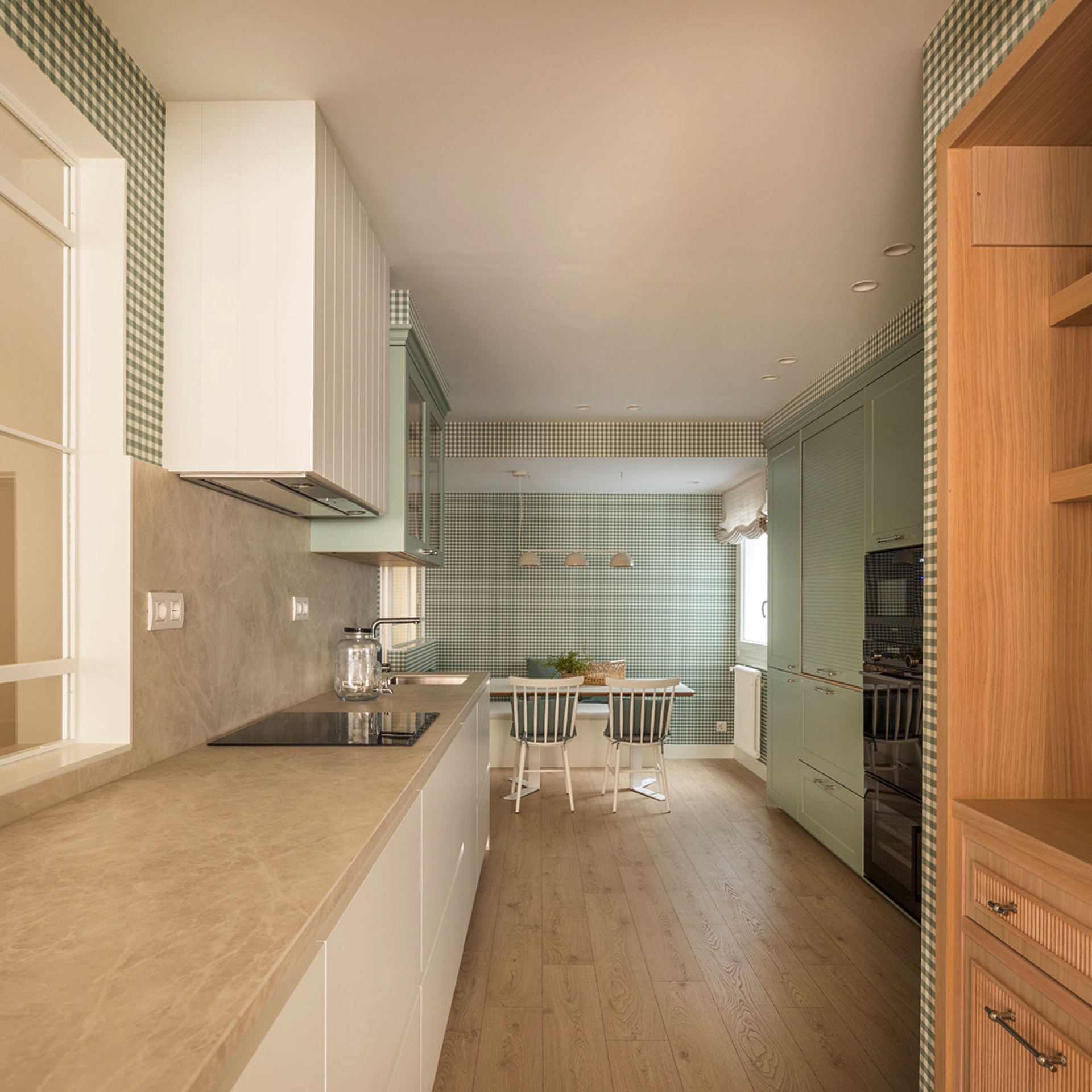 White and green Santos kitchen with eat-in area.