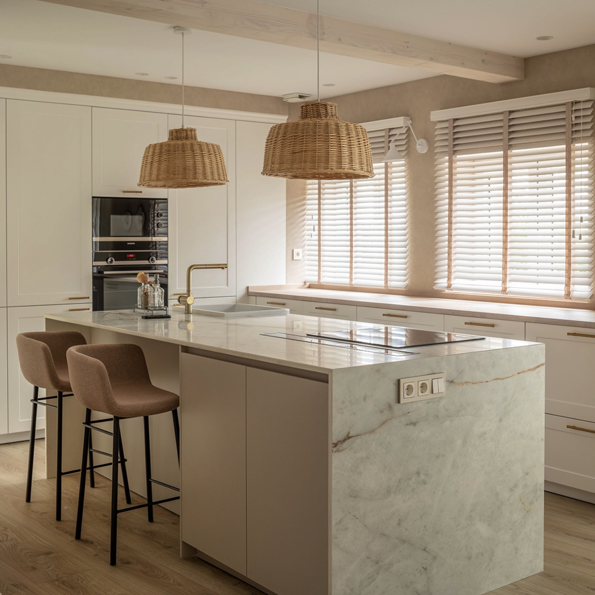 Santos kitchen with island and tall units.
