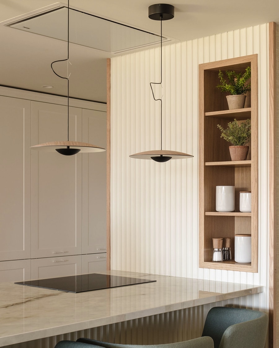 Hanging lamps in white kitchen.