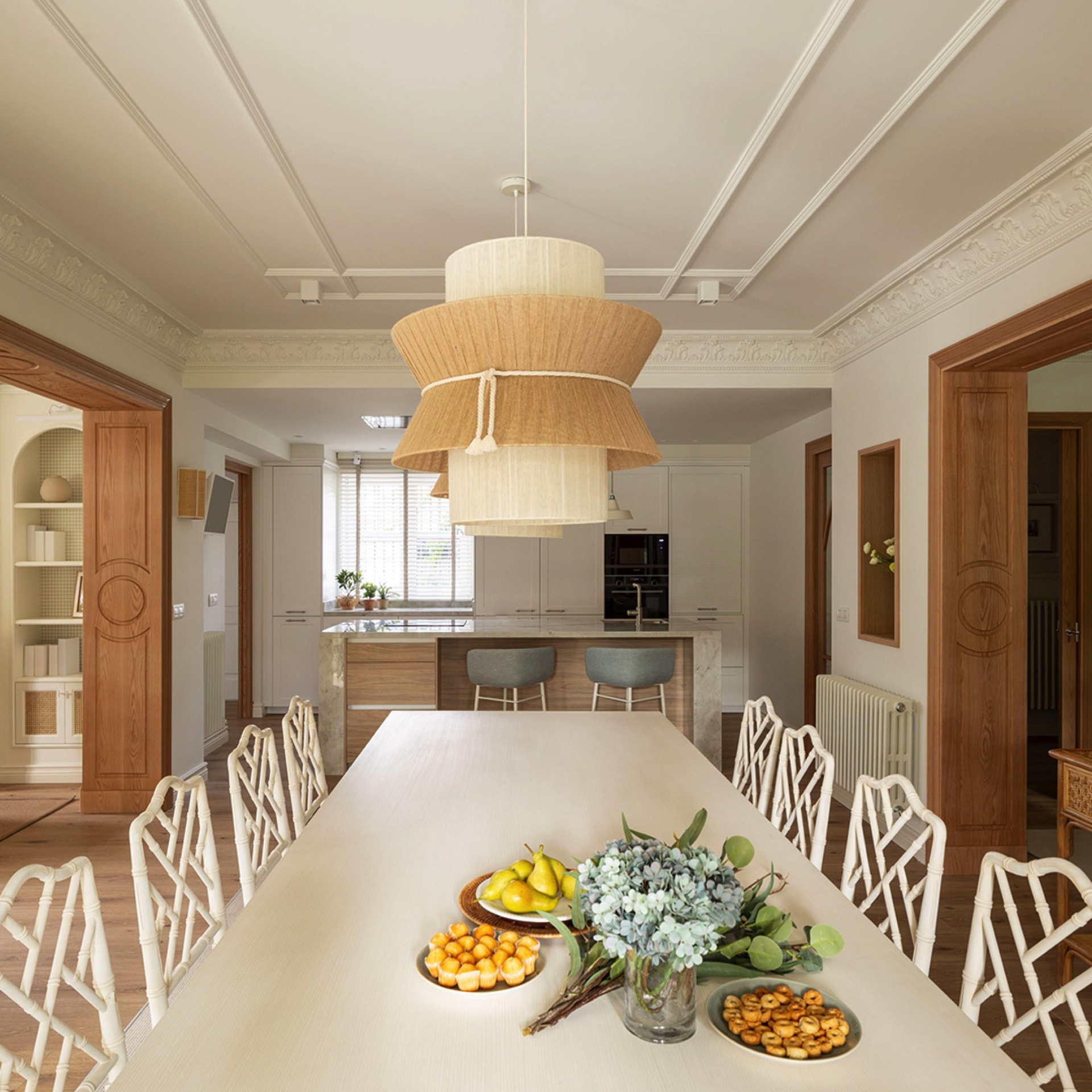 White table in open-plan kitchen with island