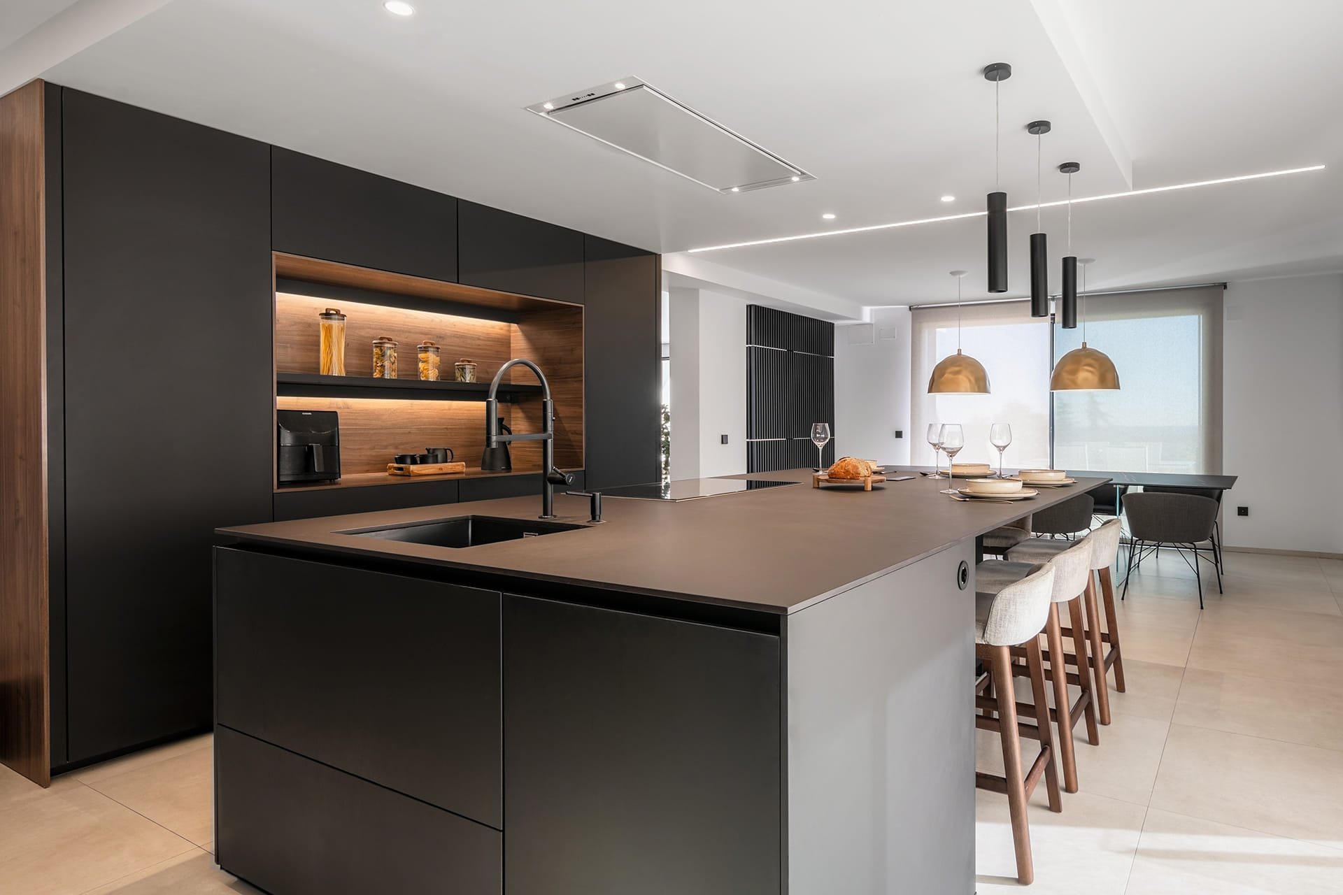 Black and wood kitchen with island designed by Santos Kitchens.