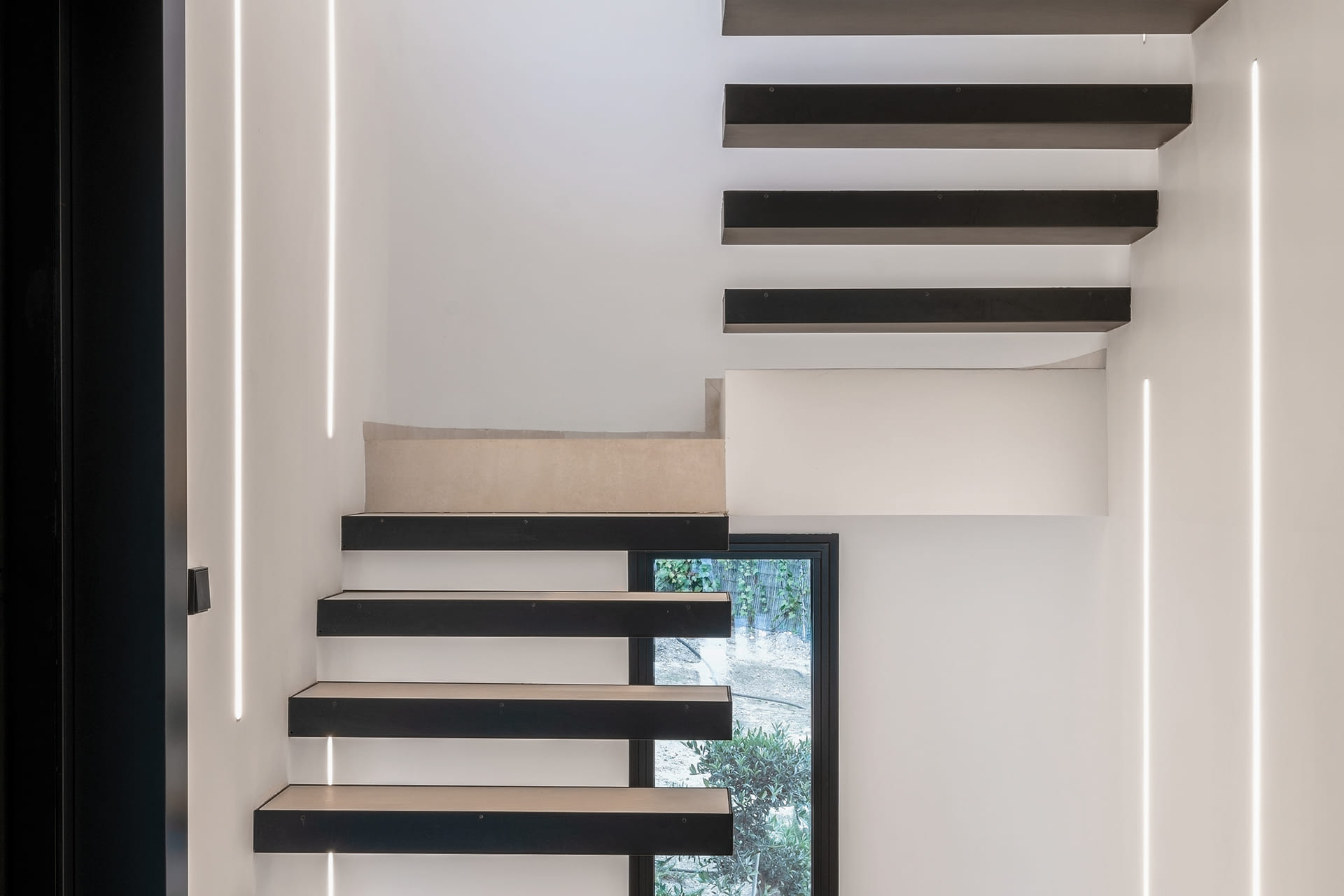 Staircase in a detached house with a Santos kitchen.