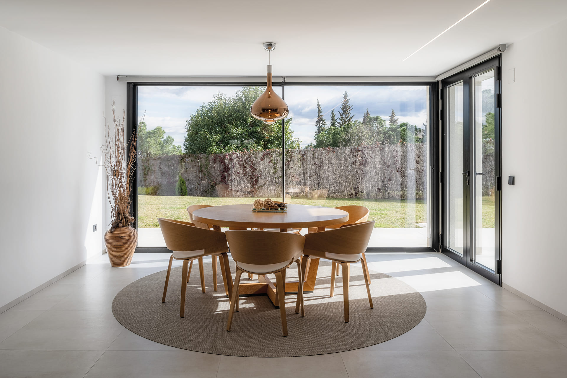 Dining table in a renovated detached house with a Santos kitchen.
