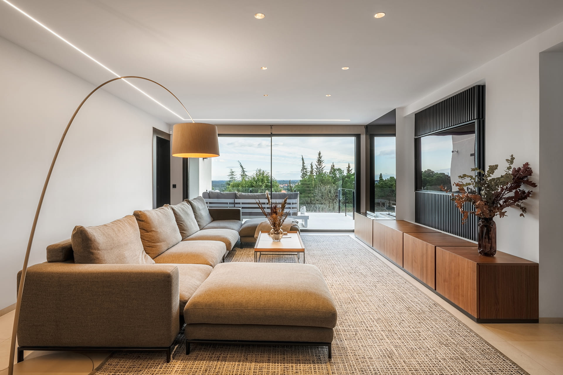View of the lounge in a renovated house with a Santos kitchen.