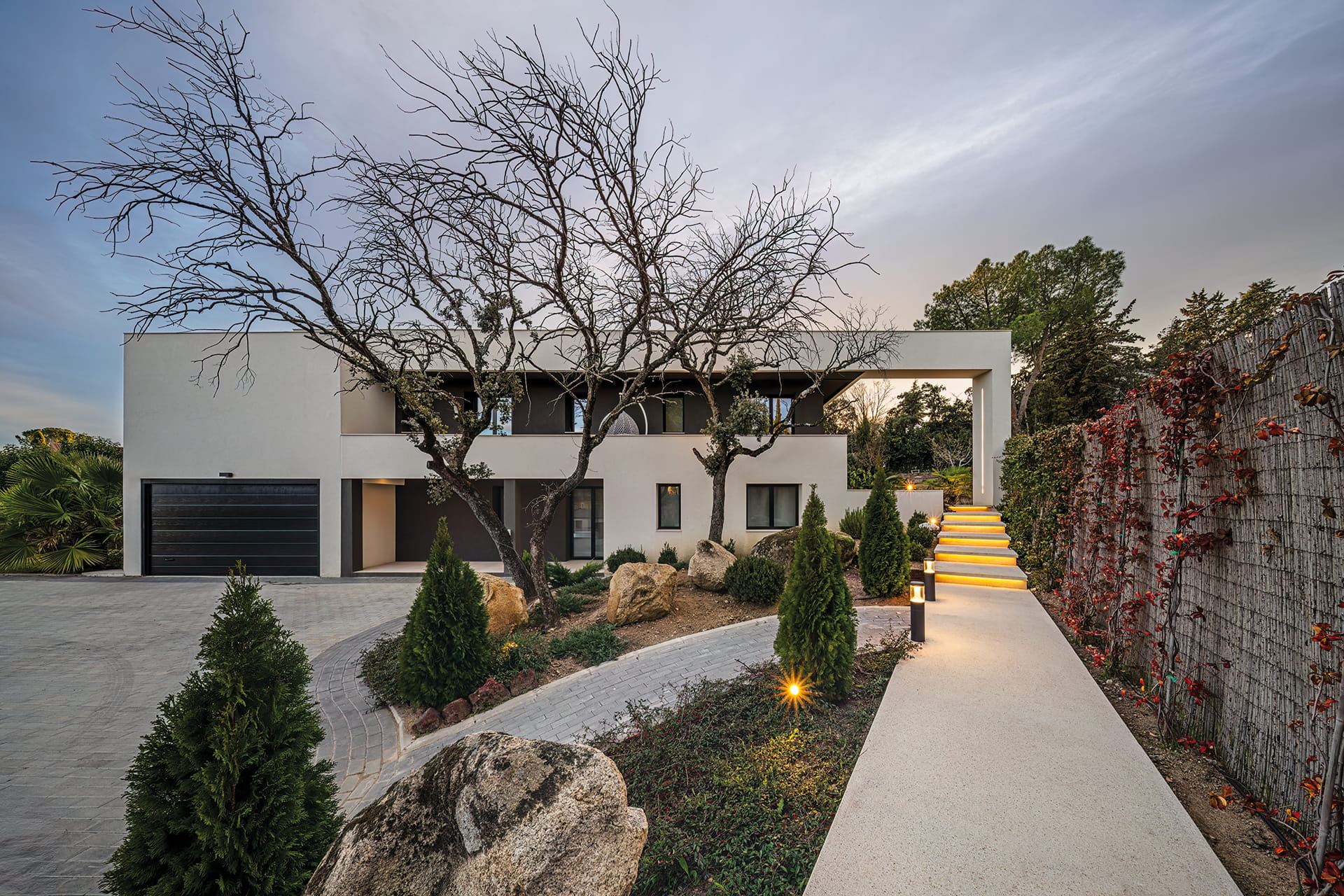Lighted outdoor area of a renovated detached house with a design by Santos Kitchens.