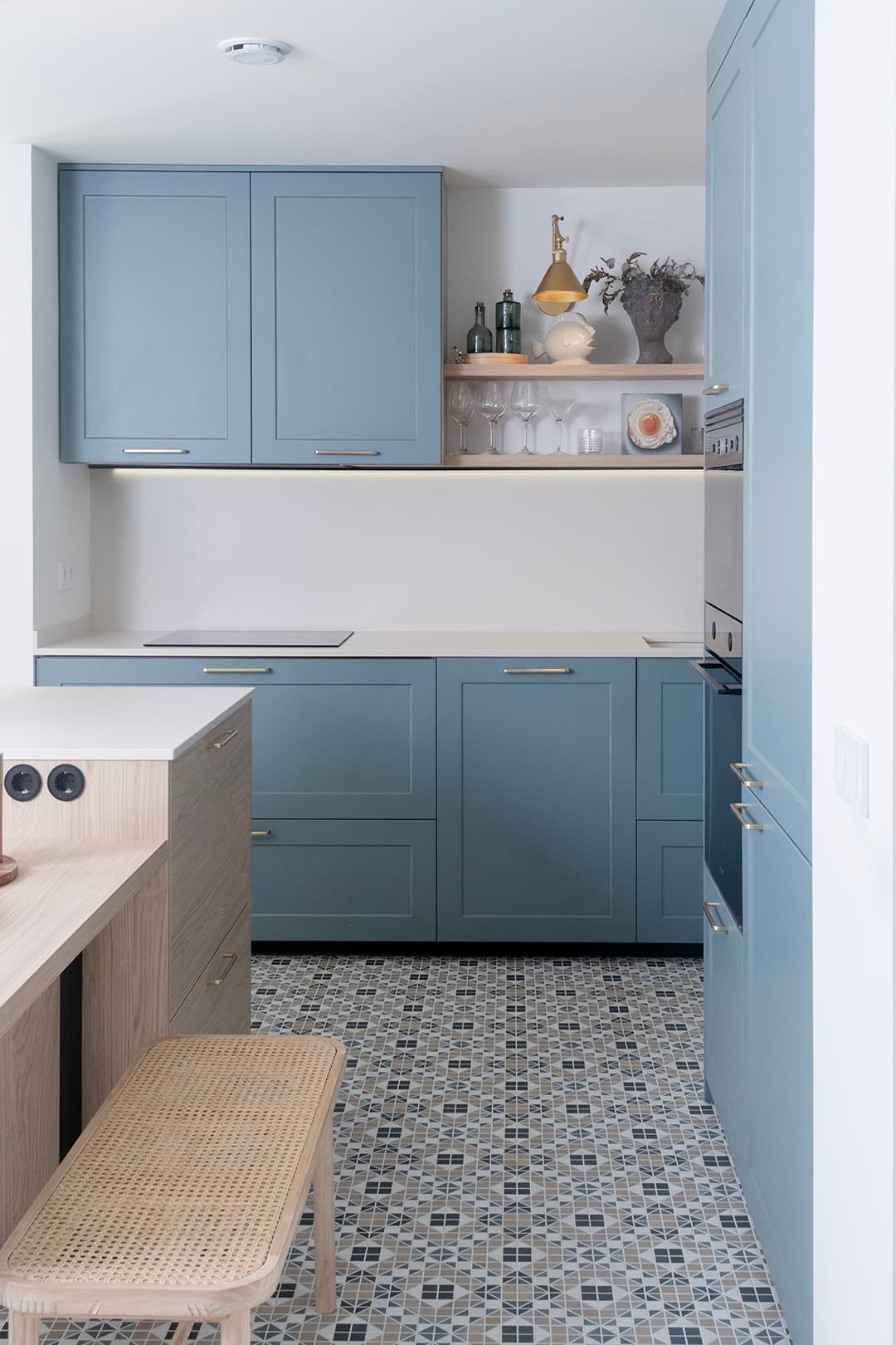 Blue kitchen cabinets in a blue kitchen designed by Santos Kitchens .