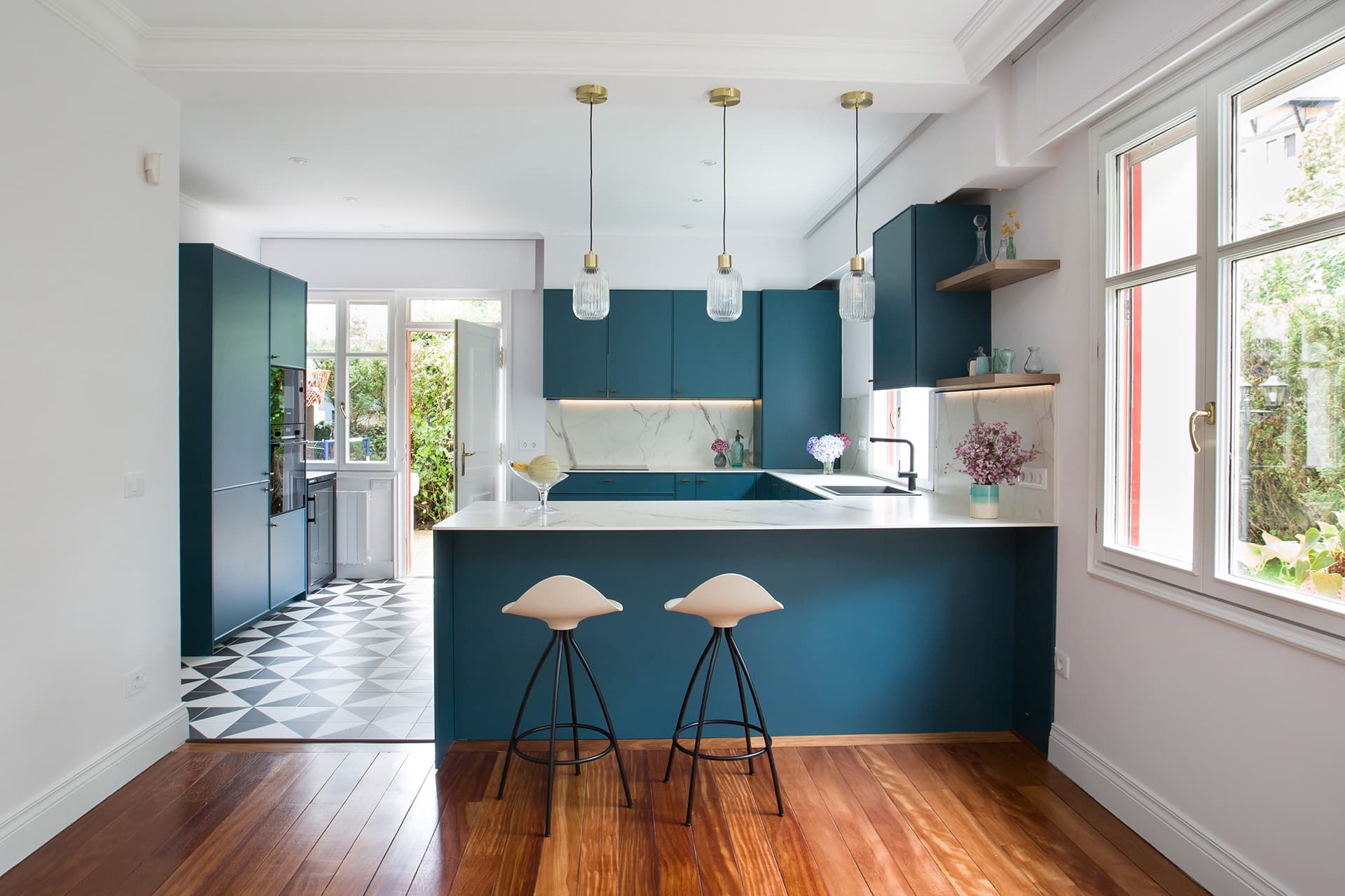 Blue and white kitchen with counter designed by Santos Kitchens.