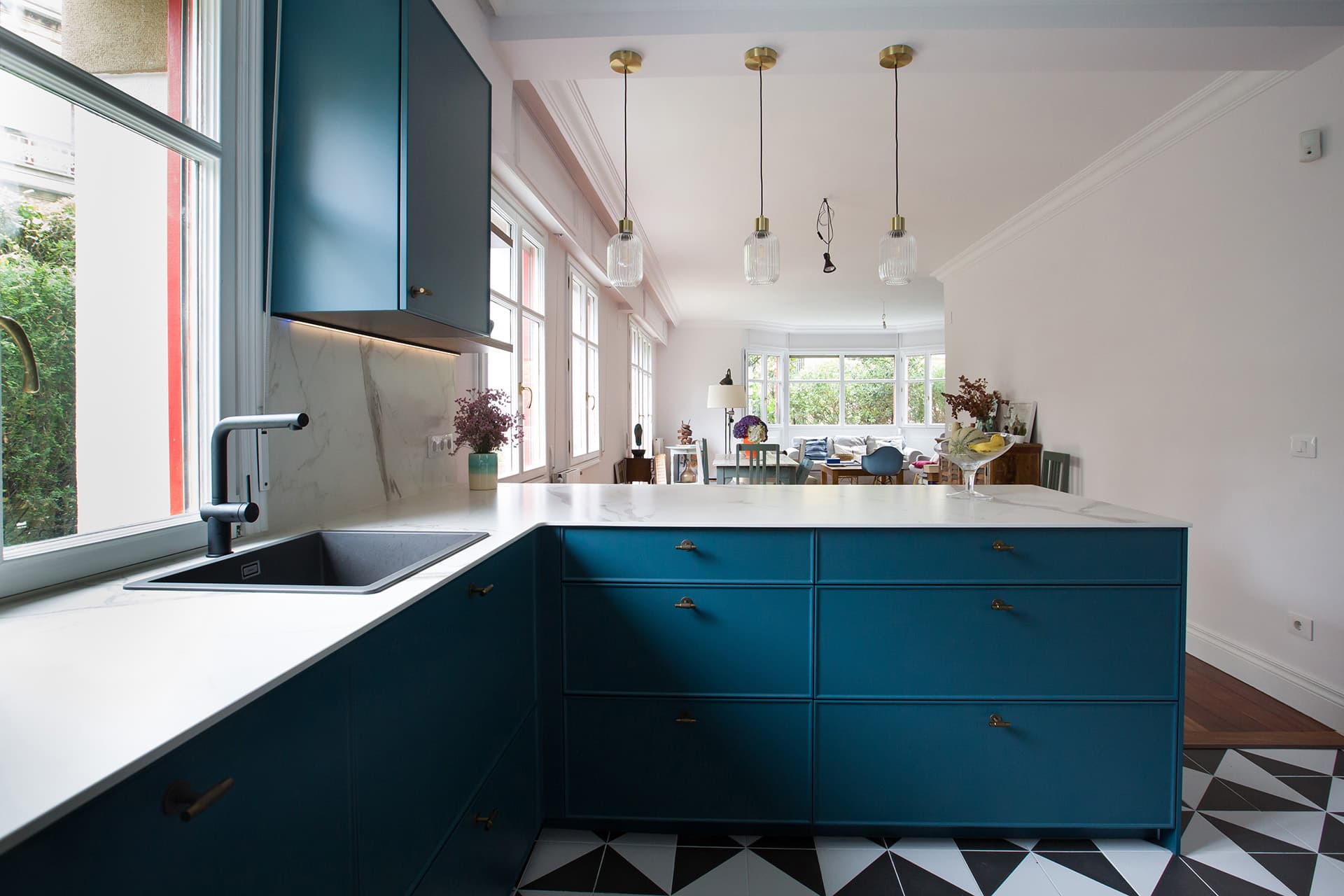 Blue and white kitchen with worktop in Light Stone in a Santos Kitchens design.