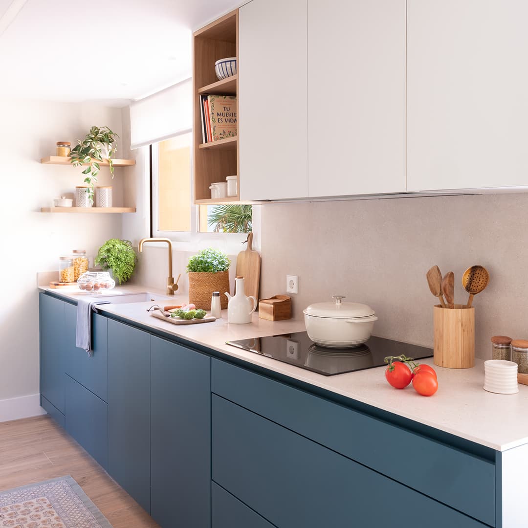 Blue kitchen with white worktop designed by Santos Kitchens.