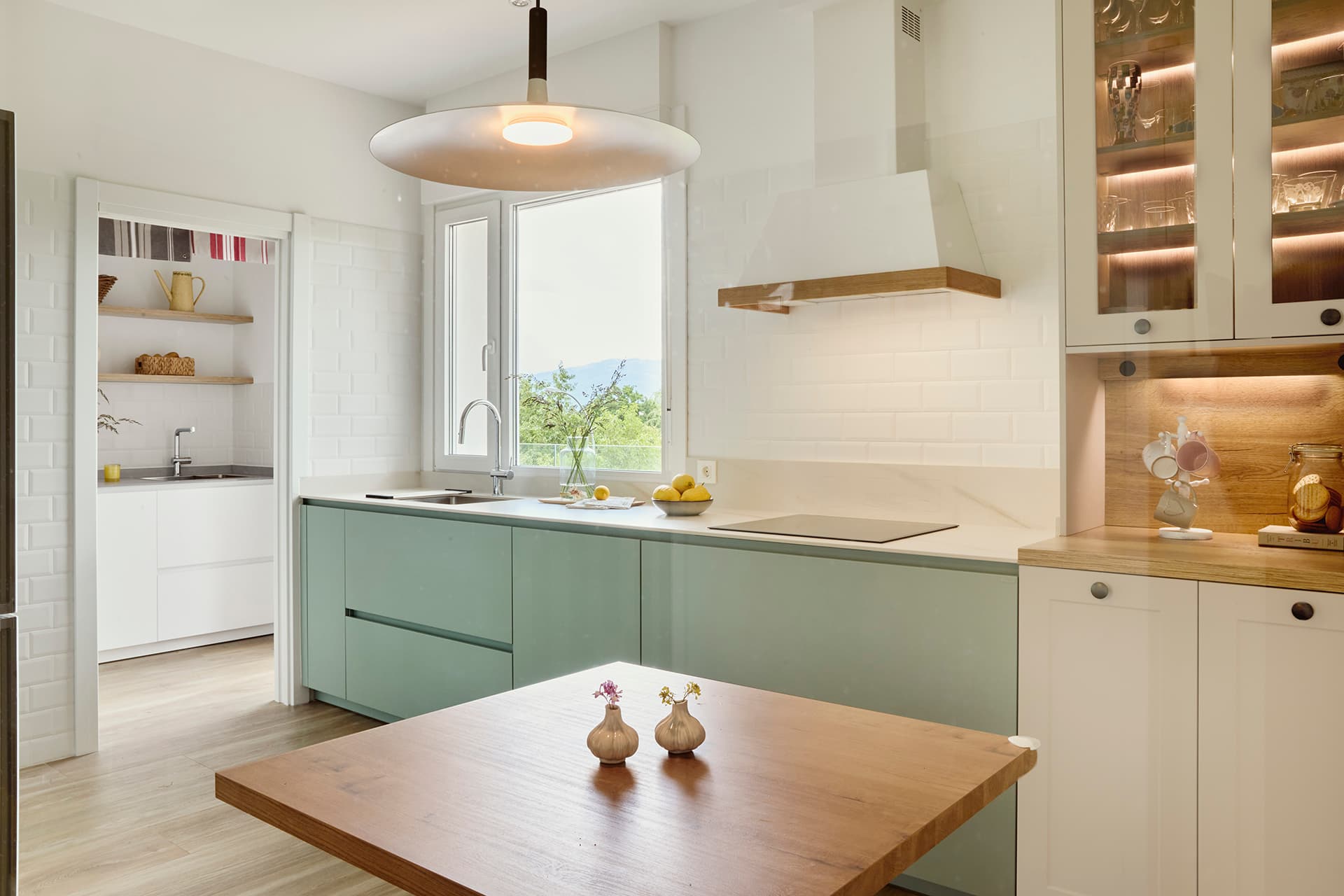 Sage Green Silk Matt Karmel kitchen designed by Santos Kitchens.