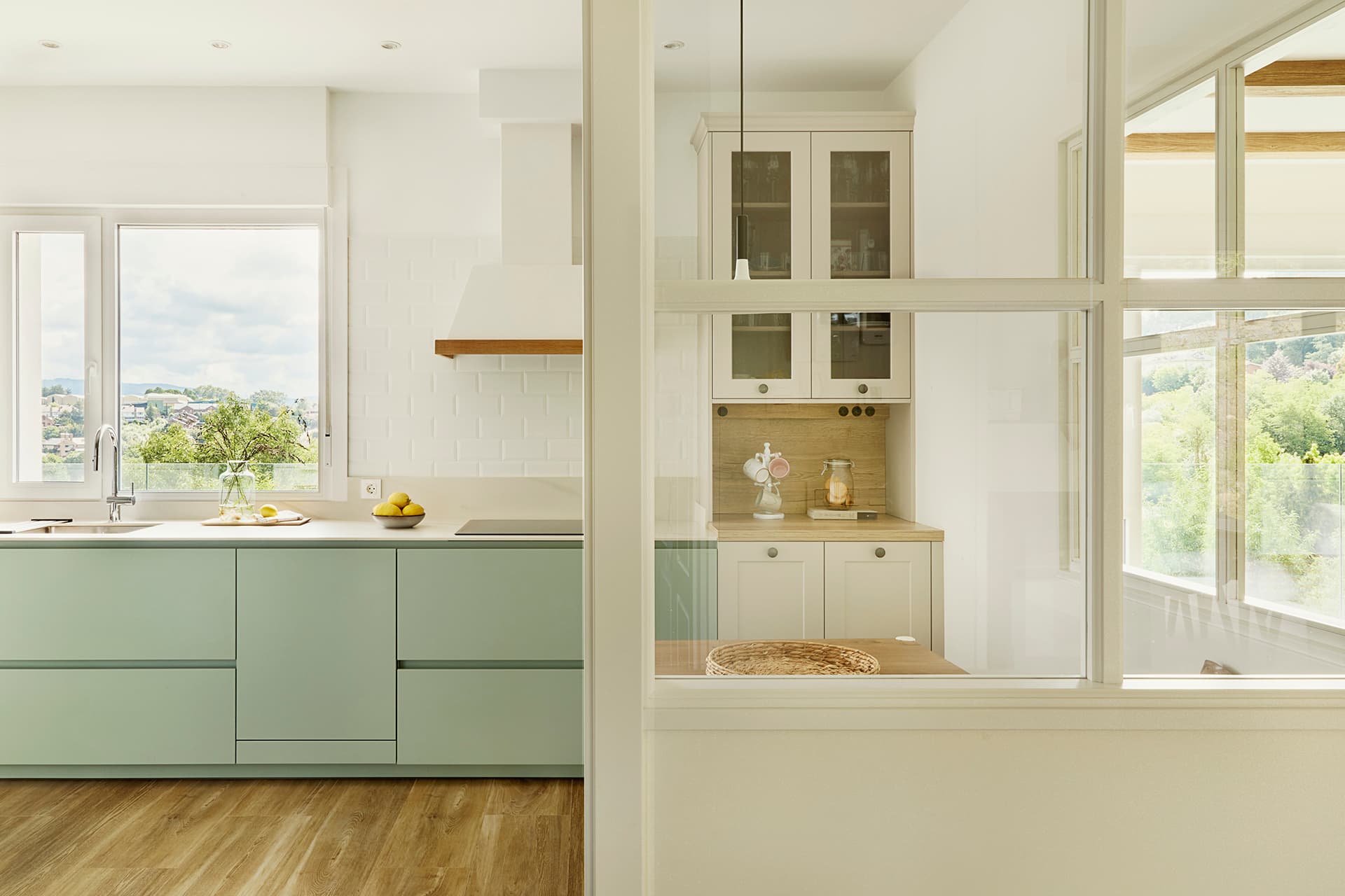 Sage Green kitchen with parallel layout designed by Santos Kitchens.