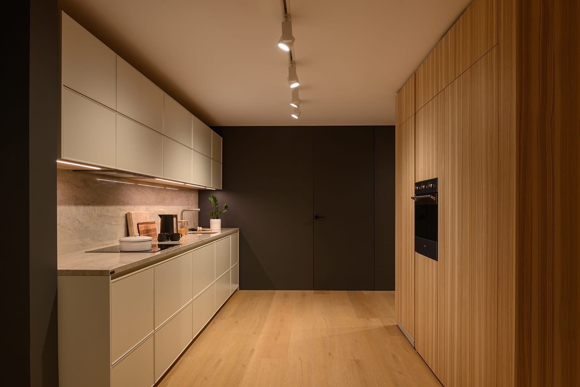 Parallel white kitchen at the Santos showroom in Riyadh.
