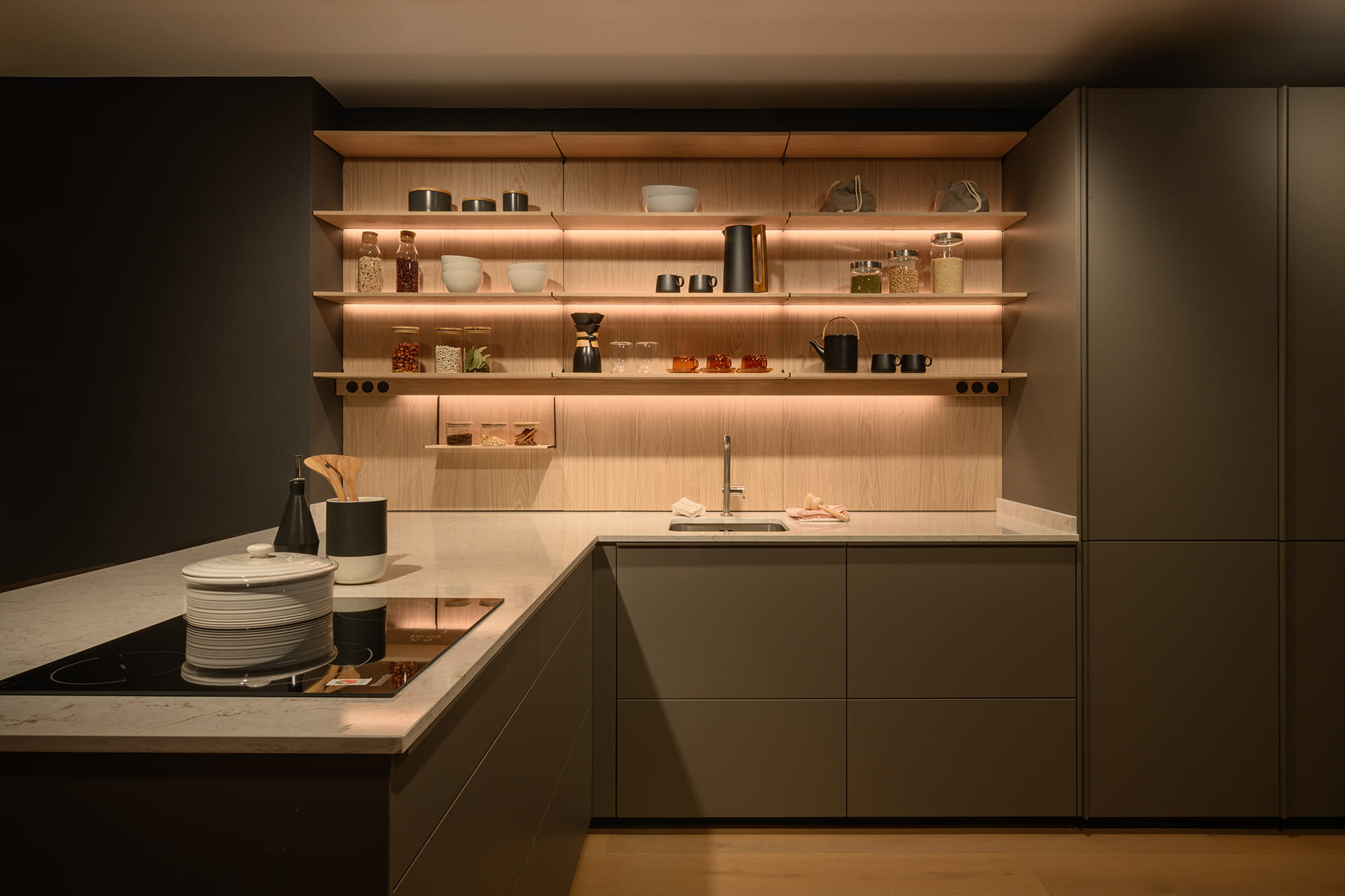 U-shaped grey kitchen by Santos Kitchens at the eba Riyadh showroom.