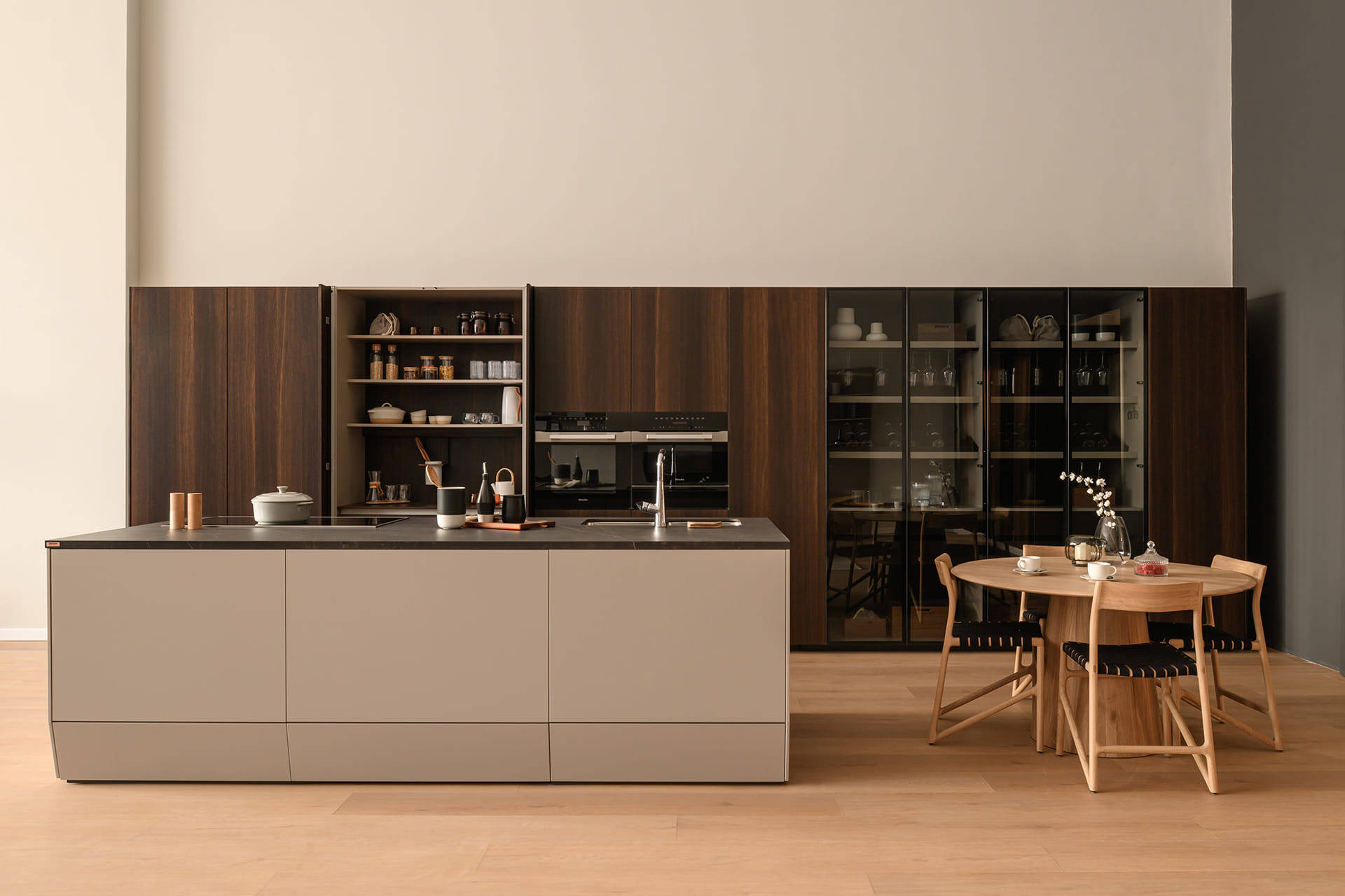 Kitchen with island integrated into the lounge at the Santos showroom in Riyadh.