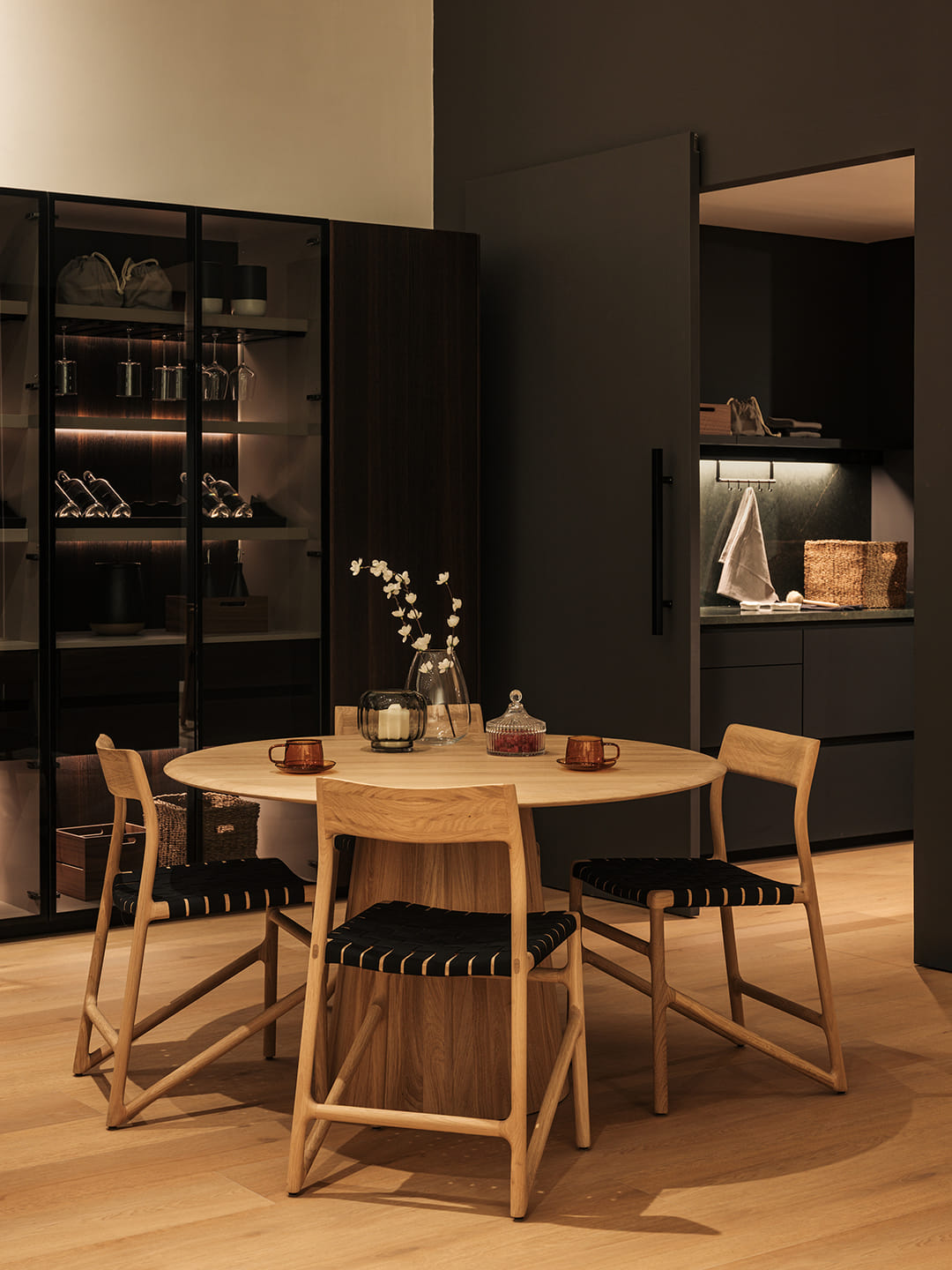 Dining area with glass door unit and access to the kitchen at the Santos showroom in Riyadh.