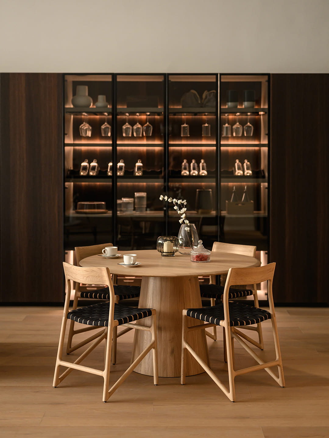 Dining area with glass door units featuring interior lighting at the Santos showroom in Riyadh.