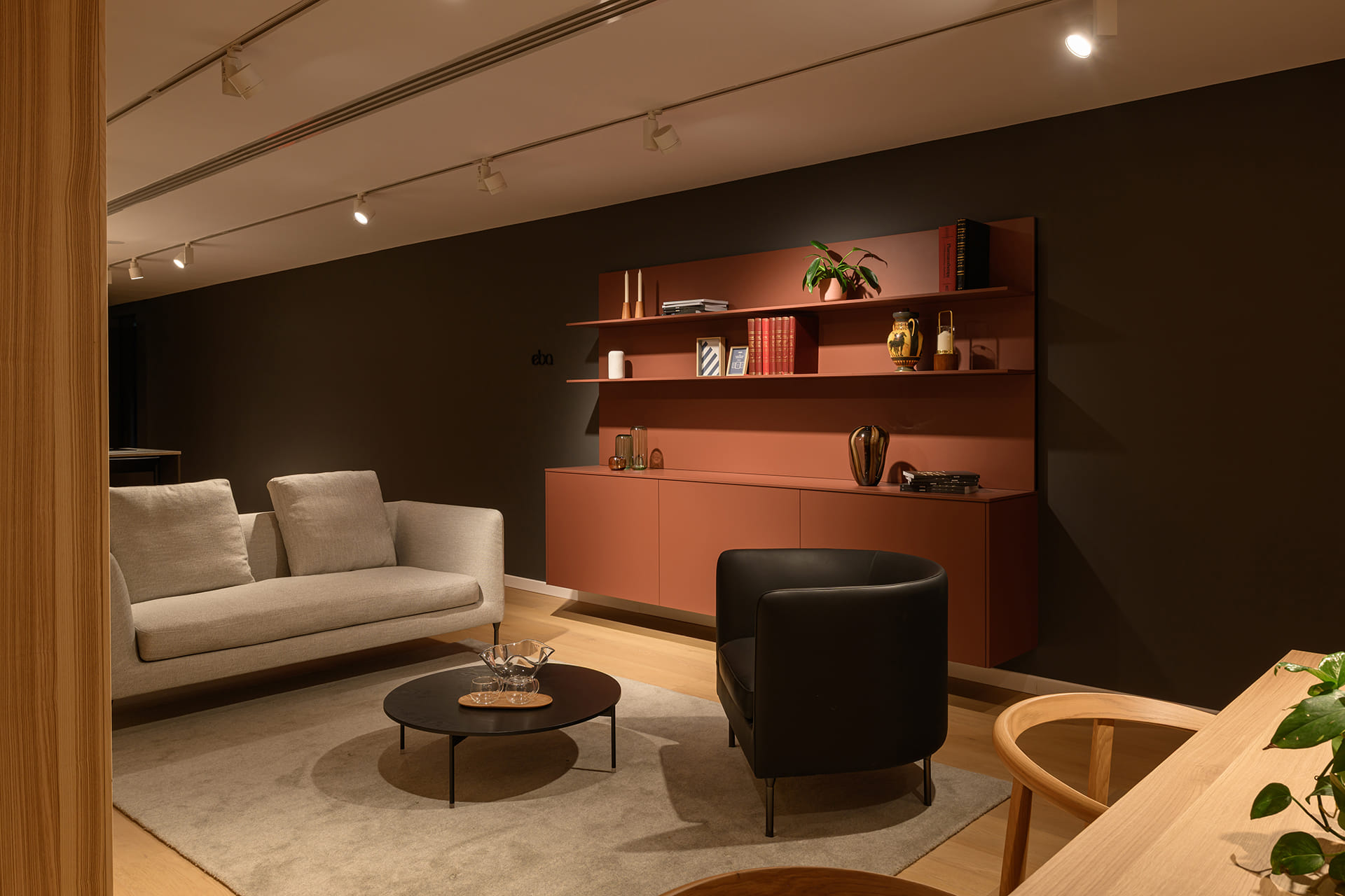 Lounge with furniture in India Red Silk Matt at the Santos showroom in Riyadh.