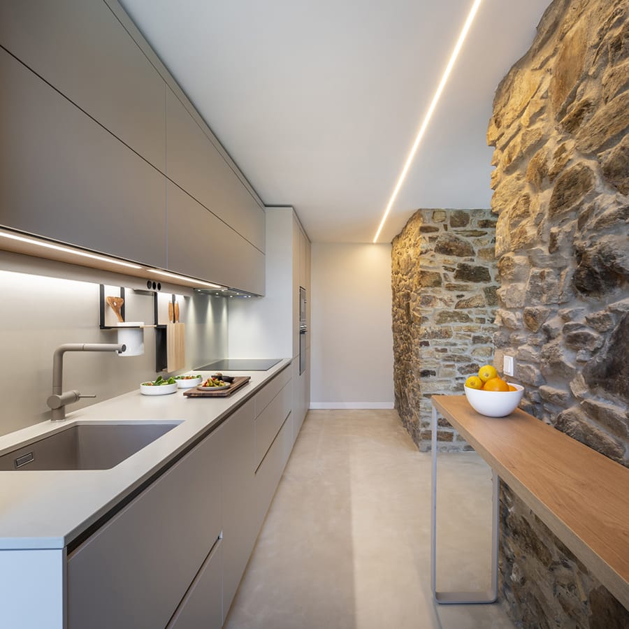 Cashmere Santos kitchen open to the lounge with a counter.