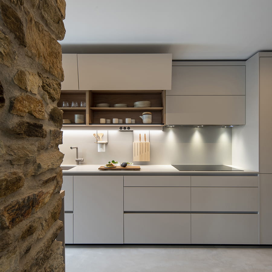 Cashmere Santos kitchen fitted out with cupboards featuring upper flap doors.