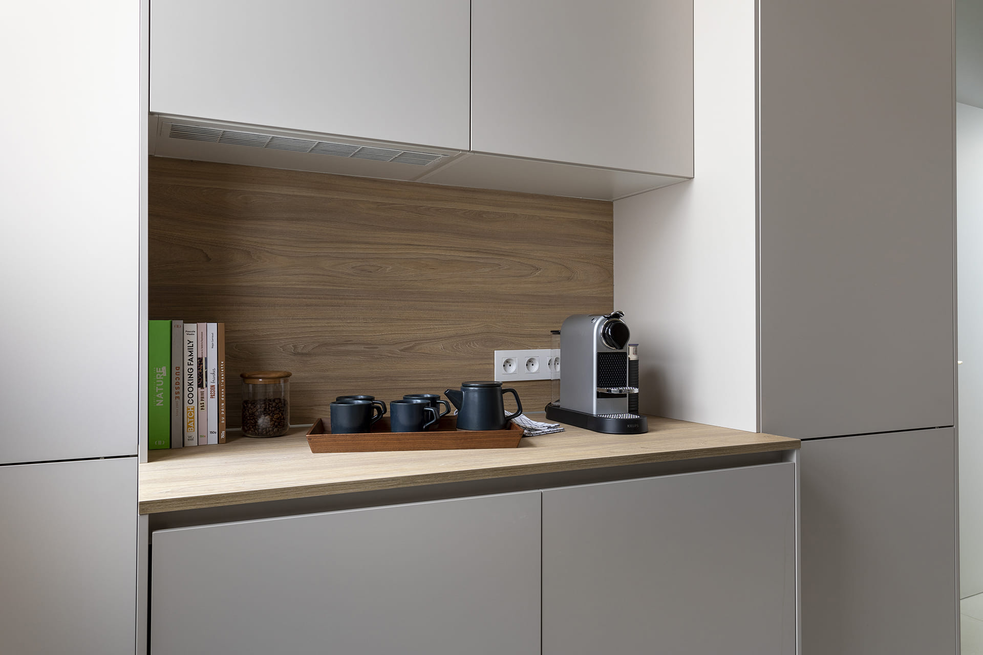 Close-up of the eat-in area with a coffee maker in a Cashmere Santos kitchen.