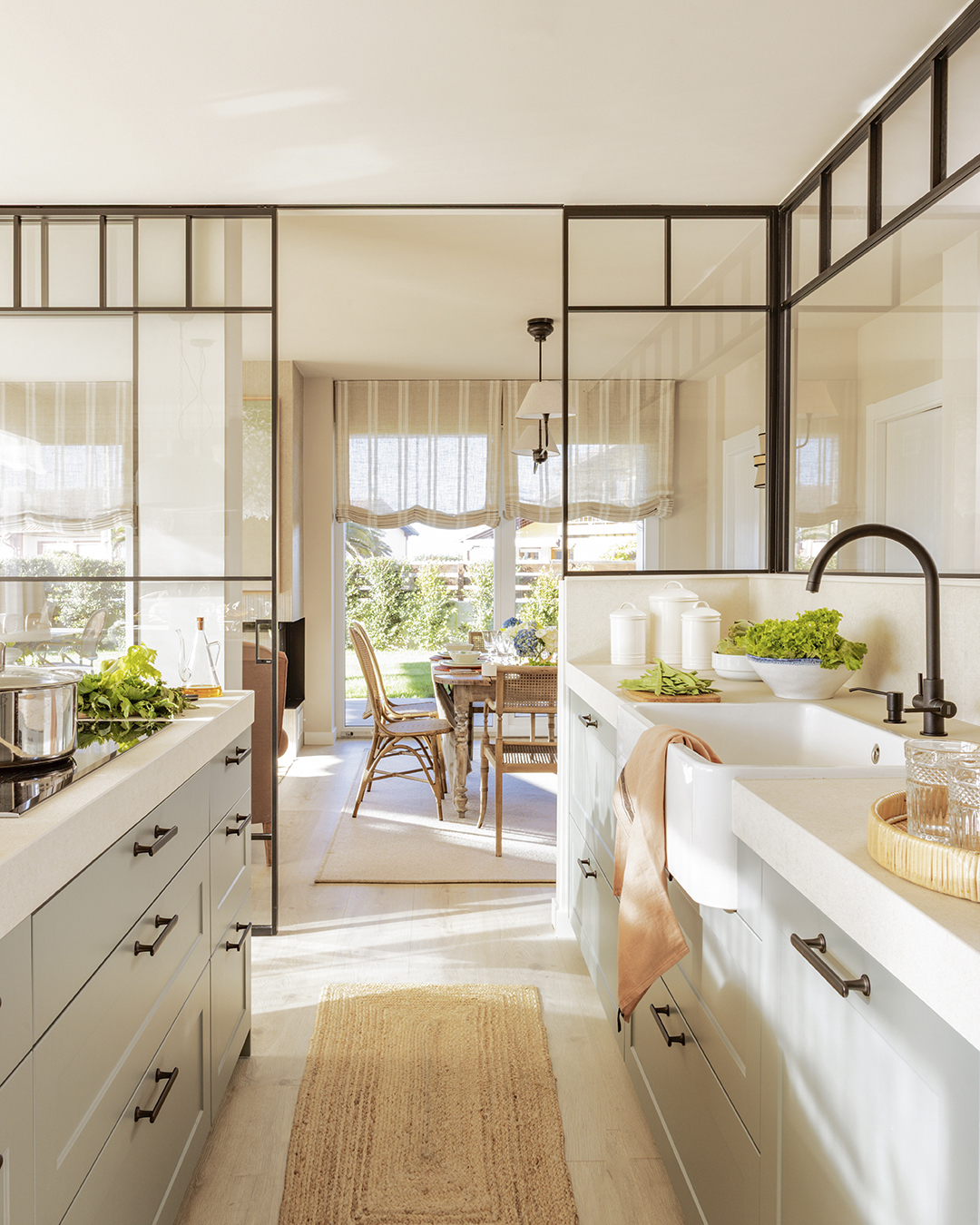Classic and timeless Santos kitchen open to the lounge with glazed enclosure.